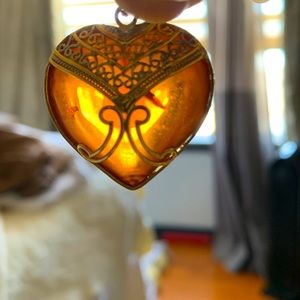Austrian amber heart shaped with mosquito sized imprint - set in 22 K gold
